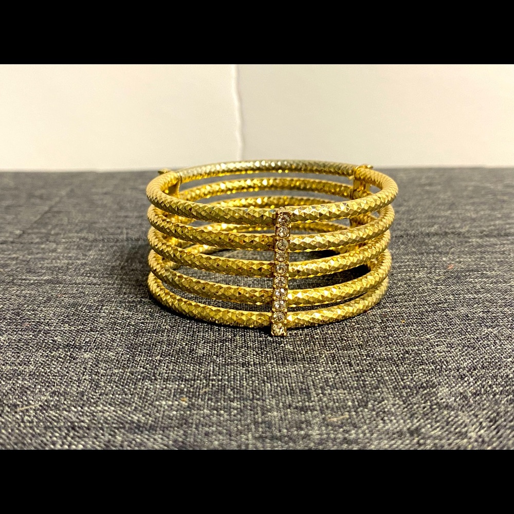 Gold coloured bracelet with diamonds